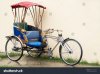 stock-photo-tuk-tuk-typical-asian-rickshaw-bicycle-oriental-antiqued-portrait-tricycle-vienti...jpeg